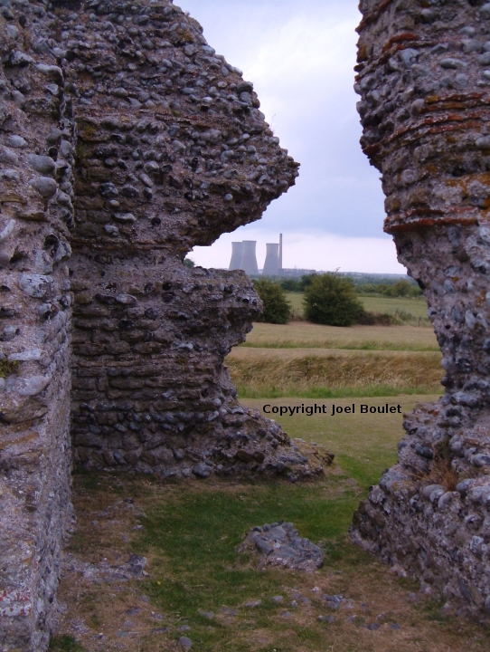 a Nuclear Power plant seen through the entrance to an old Roman fort
